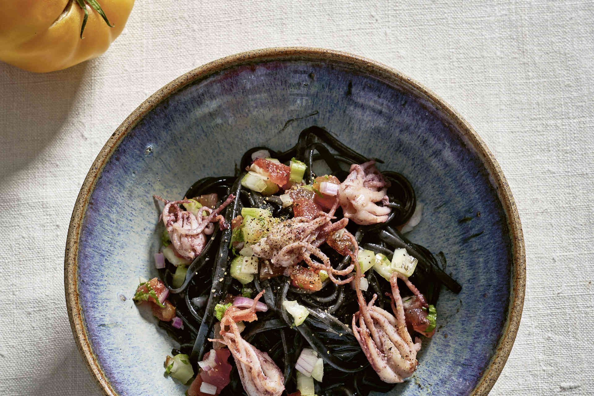 Pasta nera with calamari & tomatoes, photo provided
